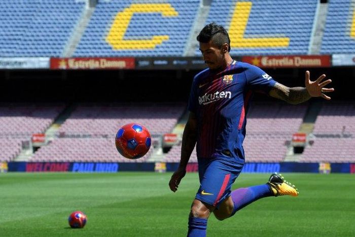 Barcelona's new signing Paulinho Bezerra kicks a ball during his official presentation, at the Camp Nou stadium in Barcelona, on August 17, 2017