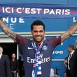 Paris Saint Germain's (PSG) new Brazilian defender Dani Alves poses with a scarf after a press conference on July 12, 2017, in Paris
