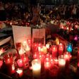 People pay tribute to the victims of the Barcelona terror attack at a makeshift memorial on the Las Ramblas boulevard