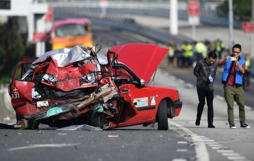 A taxi driver and two men and two women coach passengers were killed in the accident in Hong Kong