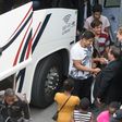 Montreal Mayor Denis Coderre greets a busload of Haitian asylum seekers from the United States as it arrives at the Olympic Stadium in Montreal on August 3, 2017