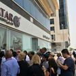 People gathered outside a branch of Qatar Airways in the Emirati capital of Abu Dhabi on Tuesday as travellers sought alternative travel plans because of bans on the airline