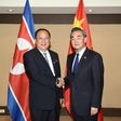 China's Foreign Minister Wang Yi (R) shakes hands with North Korea's Foreign Minister Ri Yong-Ho (L) during their bilateral meeting