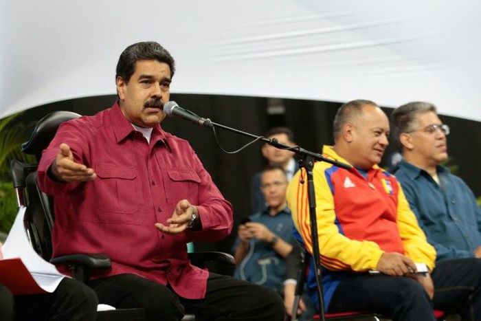 Venezuelan President Nicolas Maduro (L), shown in Caracas this week in this picture handed out by his office, rescheduled the inauguration of his controversial Constituent Assembly for Friday