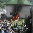 A mob sets a police station on fire in Kotkhai, around 62 km from Shimla, in the Indian state of Himachal Pradesh on July 19, 2017