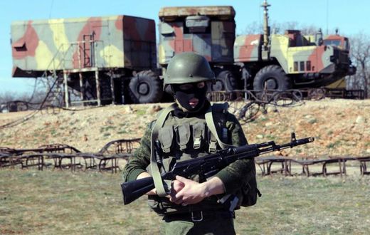 A Russian soldier stands guard in front of an S300 surface-to-air missile battery like those delivered to Syria after a September Israeli strike during which a Russian aircraft was accidentally downed