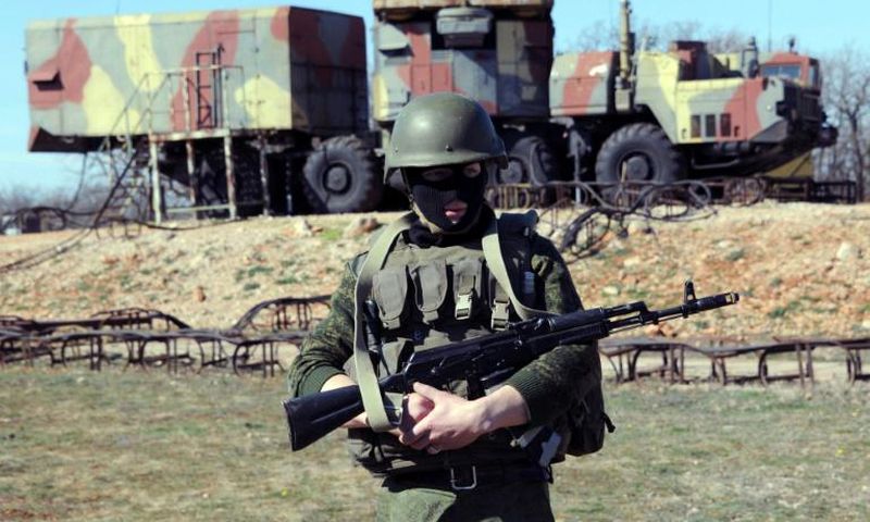 A Russian soldier stands guard in front of an S300 surface-to-air missile battery like those delivered to Syria after a September Israeli strike during which a Russian aircraft was accidentally downed