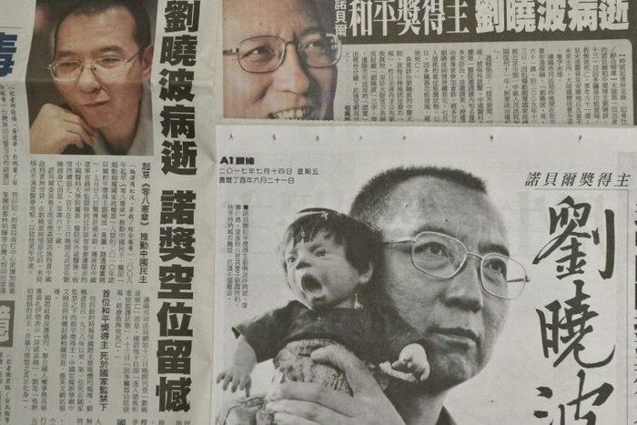This photo illustration shows a collection of Taiwanese newspapers in Taipei on July 14, 2017 reporting on the death of China's Nobel laureate Liu Xiaobo