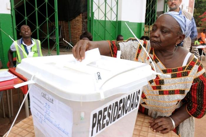 A woman casts her ballot to vote in the second round of the presidential election on May 18, 2014 in Guinea-Bissau; the country will hold a legislative election March 10, 2019
