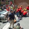 A woman receives first-aid after a car plows into a crowd in Charlottesville, Virginia after a rally by white nationalists turns violent