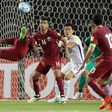 Qatar's Mohammed Kasoala (L) attempts a shot on goal during their 2018 World Cup Asia qualifying match against South Korea, at the Jassim Bin Hamad stadium in Doha, on June 13, 2017