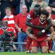 Liverpool's Mohamed Salah (R) celebrates with Sadio Mane after scoring their third goal during their match against Arsenal Liverpool, north west England on August 27