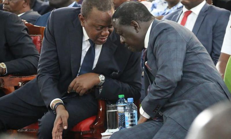 President Uhuru Kenyatta with AU envoy Raila Odinga