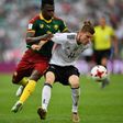 Germany's forward Timo Werner (R) challenges Cameroon's defender Ernest Mabouka during the 2017 FIFA Confederations Cup group B football match June 25, 2017
