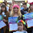 This picture taken on August 6, 2017 shows supporters of marriage equality at a protest march in Sydney