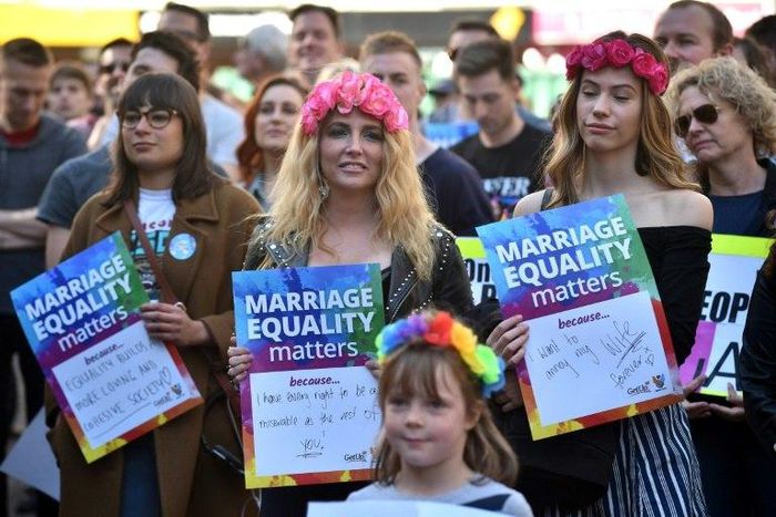 This picture taken on August 6, 2017 shows supporters of marriage equality at a protest march in Sydney