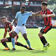 Manchester City midfielder Raheem Sterling (centre) vies with Bournemouth players during their English Premier League match at the Vitality Stadium in Bournemouth on August 26, 2017