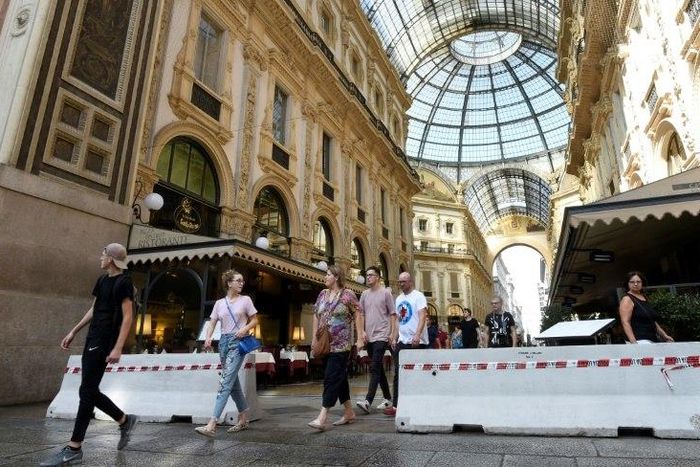 Concrete barriers have been placed at the entrance of the Vittorio Emanuel II gallery near the Duomo in Milan after the attacks in Spain