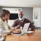 older couple doing paperwork at home