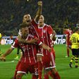 Bayern Munich's midfielder Joshua Kimmich (L) and his teammates celebrate after scoring on August 5, 2017