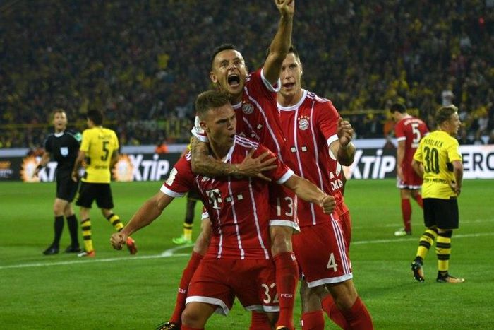 Bayern Munich's midfielder Joshua Kimmich (L) and his teammates celebrate after scoring on August 5, 2017