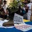 A Colombian FARC rebel turns his combat boots into a plant pot as a symbol of renouncing violence for peace, as up to 10,000 rebels prepare to return to civilian life