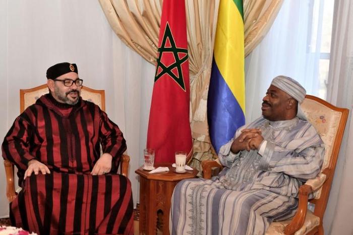 This handout picture provided by the Moroccan Royal Palace on December 3, 2018 shows Morocco's King Mohamed VI (L) visiting Gabon's President Ali Bongo at the military hospital in the capital Rabat.