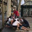 This video grab obtained from the instagram account carlos_tg_32_ shows people tending to an injured woman after a van ploughed into the crowd on Barcelona's popular Las Ramblas boulevard.