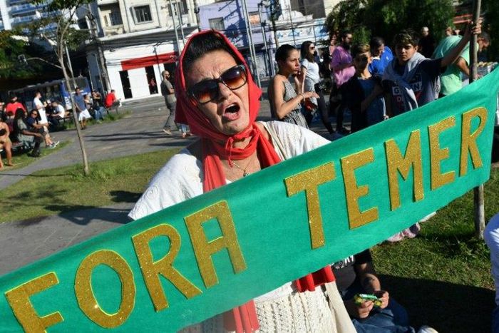 Demonstrators protest in Sao Paulo against Brazil's President Michel Temer, who faces a court verdict that could lead to his removal from office ag labor and security reforms and the government of President Michel Temer in Sao Paulo Brazil on June 4, 2...