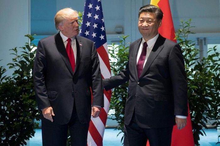 US President Donald Trump and Chinese President Xi Jinping (R) pictured prior to a meeting on the sidelines of the G20 Summit in Hamburg, Germany, on July 8, 2017