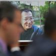 A picture of the late Chinese dissident and Nobel laureate Liu Xiaobo is seen as witnesses testify before a US House subcommittee on his death
