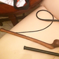 A whip and a wooden club