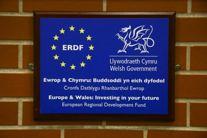 The 12 stars of the European Union displayed next to the Welsh dragon at Swansea University's new campus, which the EU helped finance