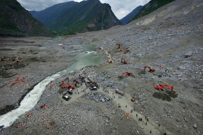 Chinese rescuers search for survivors at a landslide area in the village of Xinmo in Maoxian county, China's Sichuan province