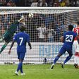 Chelsea's Michy Batshuayi (23) scores against Arsenal during their football match in Beijing's National Stadium, known as the Bird's Nest, on July 22, 2017
