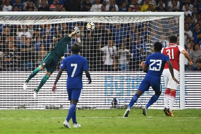 Chelsea's Michy Batshuayi (23) scores against Arsenal during their football match in Beijing's National Stadium, known as the Bird's Nest, on July 22, 2017