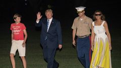 President Donald Trump, with First Lady Melania Trump and son Barron, returned to the White House on Sunday night after a 17-day "working vacation"