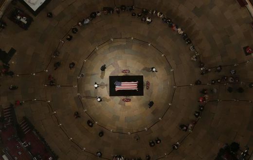 Tens of thousands of Americans have quietly filed in to pay their respects to George H.W. Bush, a man who steered the nation through turbulent times including the end of the Cold War