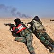 Syrian regime forces fire towards Islamic State group positions as they advance through the desert on February 7, 2017