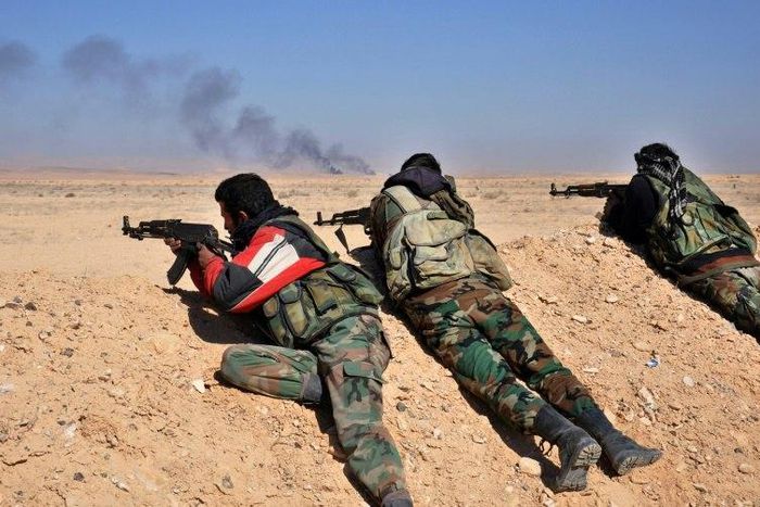 Syrian regime forces fire towards Islamic State group positions as they advance through the desert on February 7, 2017