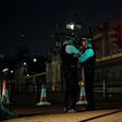 Police officers stand guard at a police cordon next to Buckingham Palace following an incident where a man armed with a knife was arrested outside the palace following a disturbance in London on August 26, 2017
