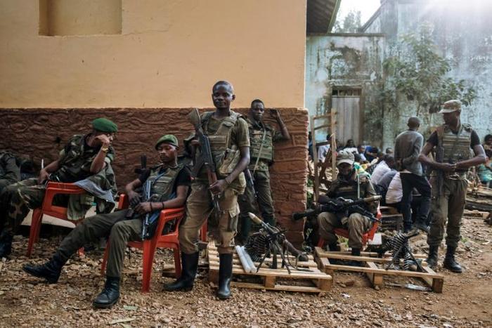 Armed forces members in DR Congo guard the entrance to the Independent National Election Commission (CENI) ahead of the presidential ballot