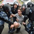Russian police officers detained anti-corruption protestors in Moscow