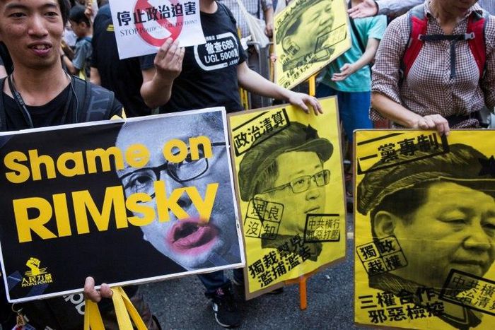 The three activists were handed jail sentences for their role in 2014's massive Umbrella Movement protests, which called for fully free leadership elections and were an unprecedented challenge to Beijing
