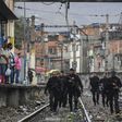 Rio police, shown here carrying out a pre-dawn crackdown on drug gangs in a favela, are demoralized and struggling to contain violence