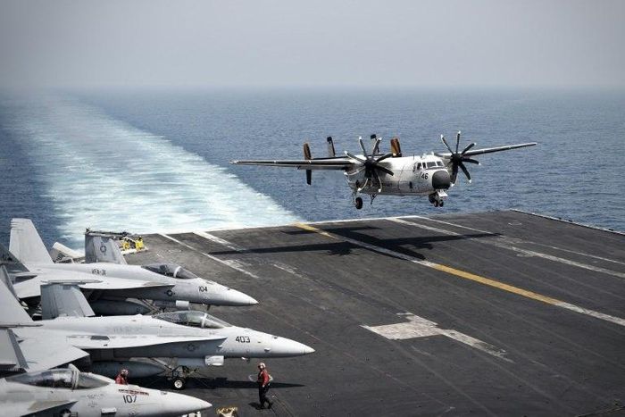 US Navy ships are sailing close to a contested island in the South China Sea in a show of strength to challenge China's territorial claims