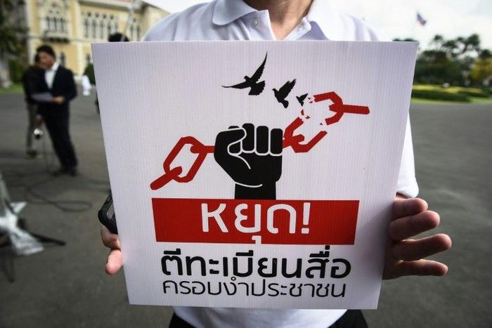 A protest in May against curbs on the Thai media: now a columnist faces charges
