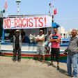 Tunisian fishermen gather on August 6, 2017 in the port of Zarzis in southeastern Tunisia to protest against a possible berthing of the C-Star vessel