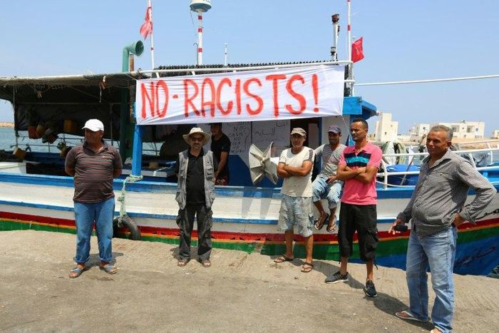 Tunisian fishermen gather on August 6, 2017 in the port of Zarzis in southeastern Tunisia to protest against a possible berthing of the C-Star vessel