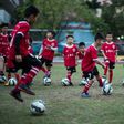 Children attend a football training session in the suburbs of Guangzhou, in southern China's Guangdong province